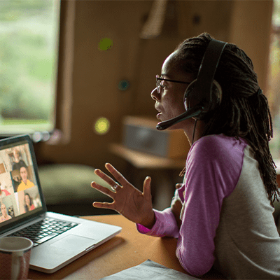 Black woman attending a zoom meeting